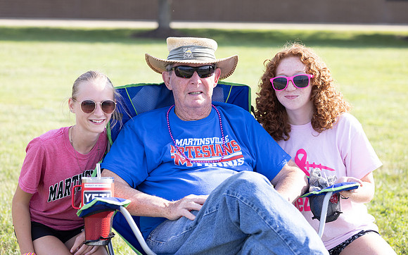 Tennis Managers along with Mr. Keller watching his grandson play tennis. (He never misses a match).