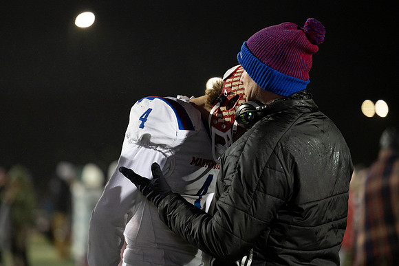 Emotions captured 2025 seniors- last senior football game aga New Pal Coach Dugger and QB